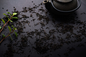 tea ceremony . lemon tea honey teapot on black background. copy space.