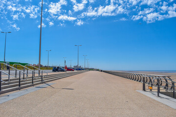 View of blue sky at walk place  with sea defenses