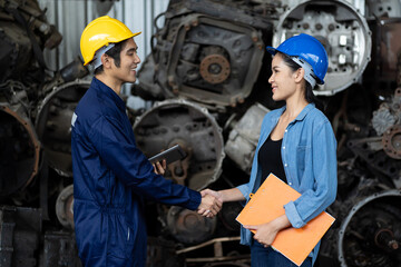 Fototapeta premium Group of Asian male and female worker successful of work at old garage parts storage warehouse