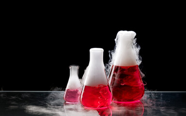 White smoke comes from a erlenmeyer flasks with red solution after addition of dry ice. Chemical...