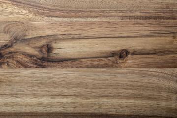 Beautiful acacia wood texture. Rustic look with veins, knots and copy space.