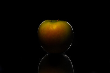 Apple red fruit isolated over black background