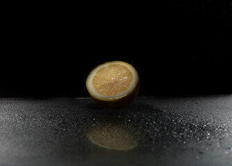 Sliced lemon on black background