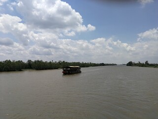 River Mekong on a sunny day with wooden boats