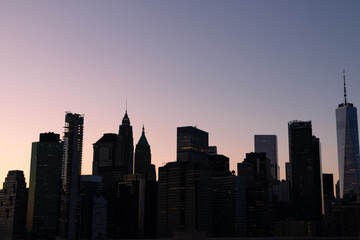 Fototapeta na wymiar New York City Lower Manhattan Skyline Silhouette during the Evening with a Clear Sky