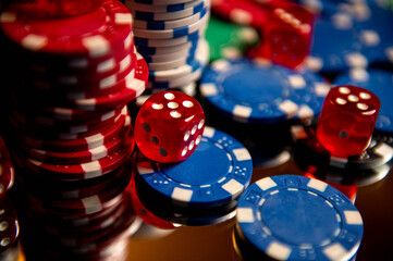 Casino. Poker. Game pieces and dice are on the table. Game chips for betting in gambling. Dice. Poker chips. 