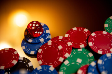 Casino. Poker. Game pieces and dice are on the table. Game chips for betting in gambling. Dice. Poker chips. 