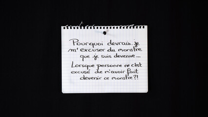 Hand written message on a ripped notebook sheet: Why should i apologize for the monster i have become, when no one apologize for making me become this monster