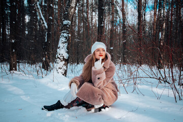 Girl in the winter in the forest