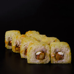 tempura rolls on a black background