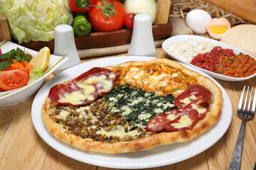 turkish mixed pitta with pastrami, sudjuk, minced meat and cheese