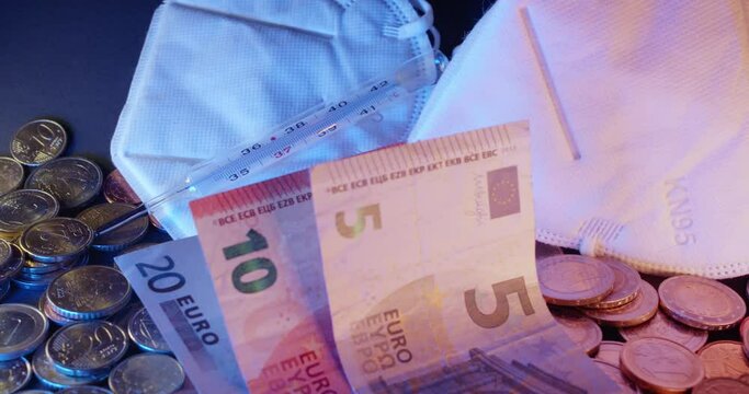 White Face Mask next to Euro Banknotes. Economy and healthcare in Europe cos for good health