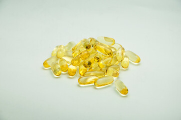 pills on a gray background. medicinal capsules on the table. treatment concept. many vitamins.omega 3 on the table