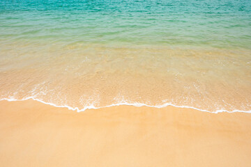 Fototapeta na wymiar Wave of thWave of the sea on the sand beach.e sea on the sand beach.