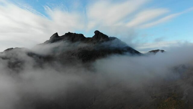 Aerial footage capturing one of Scotland's most iconic mountain summits the Cobbler. Situated in Argyll & Bute in the Scottish Highlands this footage captures it's summit peaking above the clouds.
