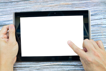 Hands holding black tablet computer with white screen,empty for text