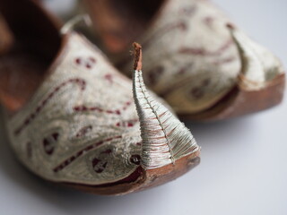 close up spiky handmade turkish leather shoes and delicate embroidery