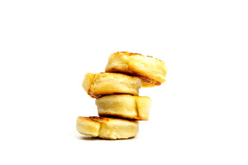 Fried potato rolls or alupatras stacked in pyramid one by one isolated on white