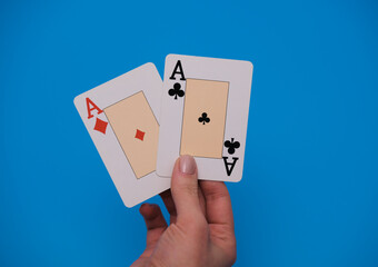 Hand holding two aces. Playing cards concept. Copy space