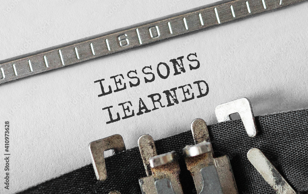 Poster text lessons learned typed on retro typewriter