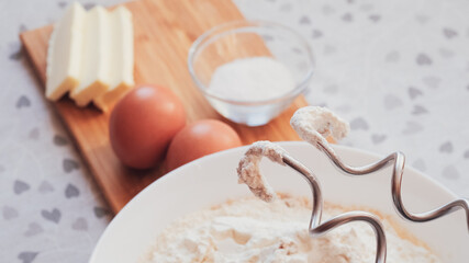 Closeup of mixer with dough for homemade pancakes. Breakfast for someone special concept. Top view, selective focus