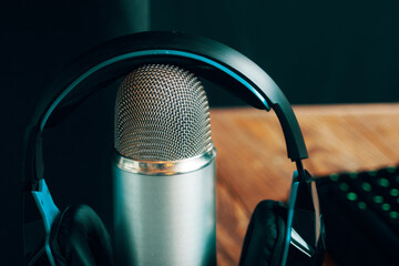 Headphones on the Mic in radiocommunication workroom. Radio show or audio podcast concept with...