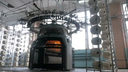 Weaving of fabric on cars. Production of fabric from threads at factory. Textile factory industry. Fabric making machines.