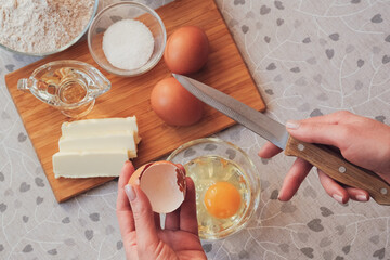 Breaking eggs for homemade pancakes. Cooking with love for someone special