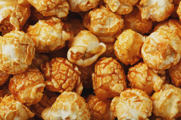 Popcorn in caramel glaze close-up as a background.