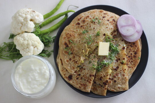 Gobi paratha or cauliflower paratha is a type of paratha or parantha or flatbread, that is stuffed with flavoured cauliflower and vegetables.