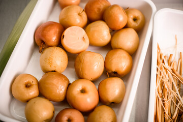 close-up of beautiful delicious pickled apples in white box