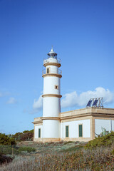 White lighthouse with blue sky