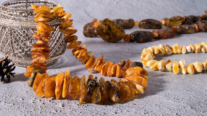 Unique natural orange, white royal and green with inclusion   old Baltic amber necklaces close up ...