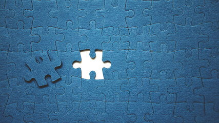 Top view flat lay of jigsaw puzzle with one piece missing .Concept of absence and...