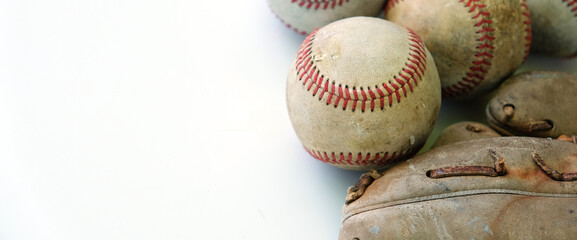 baseball and glove closeup isolated on white background