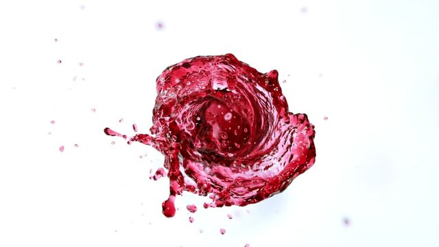 Super Slow Motion Shot of Red Wine Vortex Splash Isolated on White Background at 1000 fps.