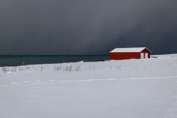 Fotobehang Noord-Europa Fisherman's house on the snowy fjord
