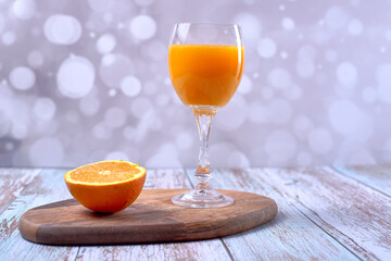 Orange juice on wooden table