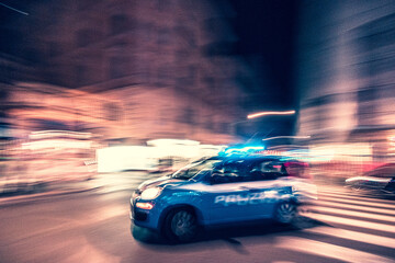 Police car in motion in Rome Italy, blurred background