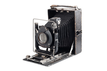 Old camera isolated on white background. Vintage photo camera in an open state.
