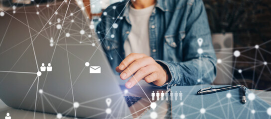 Male hands with laptop. Man working remotely at home. Concept of networking or remote work. Global business network.