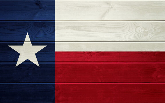 Texas State Flag on an old wooden surface.