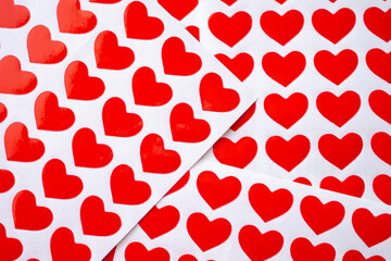 Close up red heart sticker on white paper