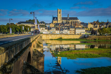 View on the gothic St Cyr Ste Juliette cathedral and the city of Nevers from the Loire River bridge
