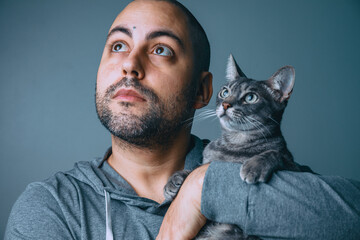 Young man with cat portrait