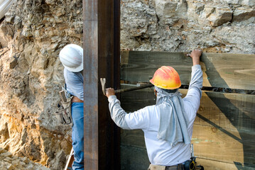 Stacking lag lumber between I-beams