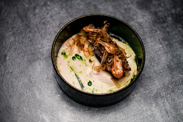 view of plate with delicious meat dish with sauce and shrimps