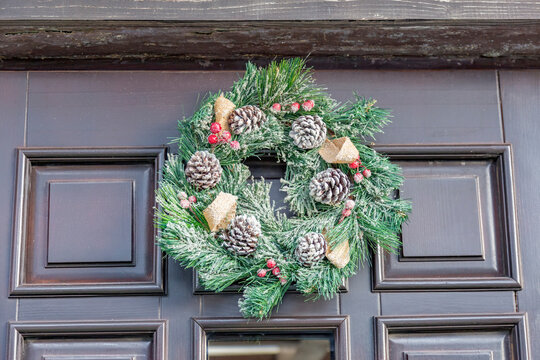 Beautiful Holiday Decoration Hanging On The Wooden Door Of The House