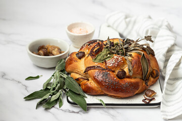 Homemade challah bread with chestnuts, onions and herbs