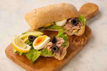 Tuna, eggs, olives  and avocado sandwiches.
